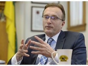 Health Minister Jim Reiter responds to questions about privatizing EMS services provincewide.