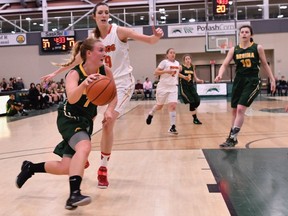 Sara Hubenig, left, of the University of Regina Cougars women's basketball team has become increasingly productive on offence to go with her stellar defensive play.