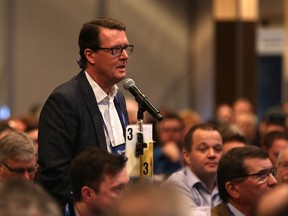 Mayor Michael Fougere asks provincial cabinet ministers a question during the 'bear pit' session at the annual SUMA convention at TCU Place in Saskatoon.