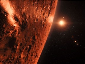 This handout artists impression released by the European Southern Observatory on February 22, 2017 shows the view just above the surface of one of the planets in the TRAPPIST-1 system.  The stunning discovery of seven Earth-like planets orbiting a small star in our galaxy opens up the most promising hunting ground to date for life beyond the Solar System, researchers said Wednesday. All seven are within 20 percent of the size and mass of our own planet and almost certainly rocky, and three are ideally situated to harbour life-nurturing oceans of water, they reported in the journal Nature.