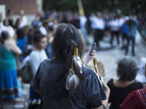 Sixties Scoop survivors and supporters gather for a demonstration at a courthouse on the day of a class-action court hearing in Toronto on Aug. 23, 2016.