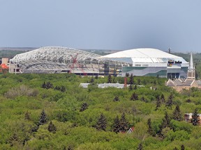 The new Mosaic Stadium rises above the trees as seen from atop the Saskatchewan Legislature Dome in May 2016. The church to the right is Holy Rosary Cathedral.