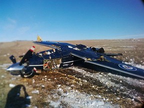A CT156 Harvard II is shown crashed south of CFB Moose Jaw, Sask., in this recent handout photo. The initial report into the crash of a training plane says the instructor and student pilot had to eject after getting into trouble practising basic aerobatics. Both Royal Canadian Air Force officers survived the Jan. 27 bailout in southern Saskatchewan but the CT-156 Harvard II aircraft was destroyed in the crash. THE CANADIAN PRESS/HO - Royal Canadian Air Force *MANDATORY CREDIT*