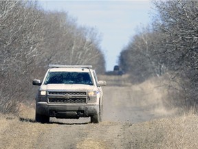 An RCMP truck from Southey drives on a grid road approximately 25 kilometres north of Craven.