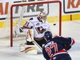 Regina Pats forward Austin Wagner scores his first of two goals against Calgary Hitmen goalie Cody Porter on Thursday. Wagner helped Regina win 5-1 and sweep a first-round WHL playoff series. The victory also gave Regina its first 12-game winning streak since 1982.