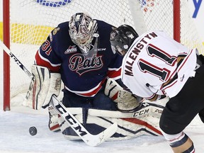 Calgary Hitmen forward Beck Malenstyn takes a shot on Regina Pats goalie Tyler Brown in WHL action at the Scotiabank Saddledome February 8, 2017.