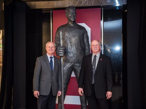 Mark Howe, left, and Marty Howe pose for a picture during the unveiling of a statue of their father, Gordie Howe, at the Hockey Hall of Fame in Toronto on March 10, 2017.