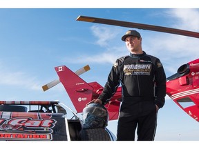 Kody Scholpp the STARS 2017 VIP standing by his race car and STARS helicopter.