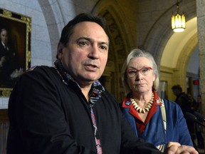 Assembly of First Nations National Chief Perry Bellegarde speaks to reporters as as Indigenous and Northern Affairs Minister Carolyn Bennett looks on during a press conference on Parliament Hill, Friday, March 10, 2017 in Ottawa.