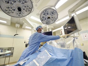 Dr. Steven Pooler, one of three bariatric surgeons in Regina, demonstrates the surgical setup for bariatric surgery in an operating room at the Regina General Hospital.