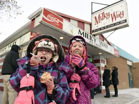 Despite chilly temperatures, the Milky Way opened for the 2017 season on Friday. Emily, left, and her sister Cadence Bryanton enjoy their first Milky Way of the year.