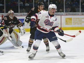 Regina Pats centre Adam Brooks attempts to deflect an incoming shot during Game 1 of WHL playoff action against the Calgary Hitmen on Friday night.