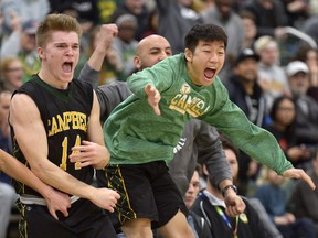 Josh White, 14, and Dex Hong, right, of the Campbell Tartans celebrate during their team's 5A boys gold-medal game against the LeBoldus Golden Suns on Saturday at the University of Regina. Campbell won the game, ending the Golden Suns' streak of four consecutive provincial titles.