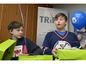 REGINA, SASK : March 29, 2017 - Hunter Puchkarenko, left, and Thomas Cabana react to the news that they're going to Disney Land.