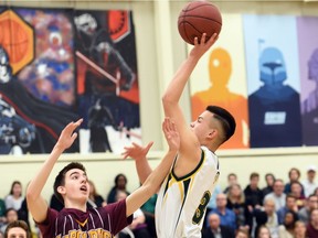 Tyrese Potoma, right, of Campbell is guarded by Ben Hillis of LeBoldus in the Regina Intercollegiate Basketball League's 2016 senior boys tier 1 final. LeBoldus won that game and later captured its fourth consecutive provincial final. Campbell and LeBoldus are to meet again Saturday, 7 p.m., in Hoopla's 5A boys gold-medal game.