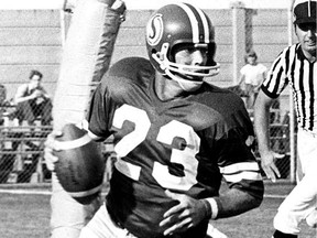 The CFL should name a trophy after Ron Lancaster, shown in action with the Saskatchewan Roughriders in 1976, according to columnist Rob Vanstone.