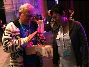 SASKATOON, SK - March 1, 2017 - Bill Morrell, who has been involved with Telemiracle for 40 years, picks up donations from backstage which he runs back and forth to the treasury where they tally up the total raised at Telemiracle 41 at TCU Place in Saskatoon on March 5, 2017. (Michelle Berg / Saskatoon StarPhoenix)