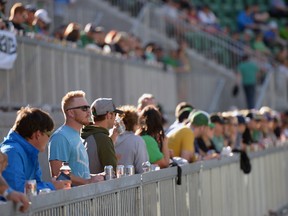 People stand in the Terrace section of the new Mosaic Stadium test event featuring the University of Regina Rams vs. the University of Saskatchewan Huskies on Saturday Oct. 1, 2016.