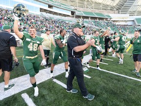 University of Regina Rams' head coach Steve Bryce celebrates a victory over the University of Saskatchewan Huskies at the new Mosaic Stadium in Regina.