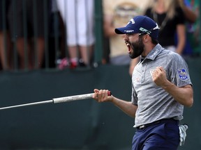 PALM HARBOR, FL - MARCH 12: Adam Hadwin of Canada reacts on the 18th green after winning the Valspar Championship  during the final round at Innisbrook Resort Copperhead Course on March 12, 2017 in Palm Harbor, Florida. Hadwin won with a score of -14.