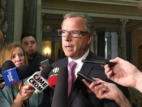 Sakstchewan Premier Brad Wall talks to members of the media in Regina on Tuesday, March 7, 2017. Wall says the government wants to cut compensation costs across the public sector by about 3.5 per cent in the coming fiscal year.