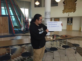 Kevin Bear, FNUniv student, reads a new Cree word from 100 Days of Cree