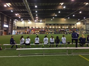 A team sits on the bench during the Under 17 girls final at the World Class Players Cup on Saturday at the EventPlex in Regina. PHOTO ASHLEY ROBINSON