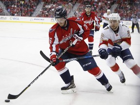 Regina-born right-winger Garrett Mitchell, forefront, made his NHL debut Sunday with the Washington Capitals.