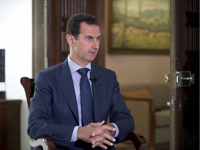 In this Wednesday, Sept. 21, 2016 photo released by the Syrian Presidency, Syrian President Bashar Assad speaks to The Associated Press at the presidential palace in Damascus, Syria. Syria decried a U.S. missile strike early Friday, April 7, 2017 on a government-controlled air base where U.S. officials say the Syrian military launched a deadly chemical attack.