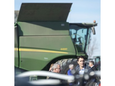 GRAY, SASK : April 27, 2017 - Rod Lewis, center, shows Prime Minister Justin Trudeau, right, around the Lewis Family Farm. MICHAEL BELL / Regina Leader-Post.