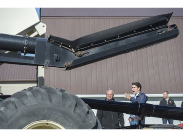 GRAY, SASK : April 27, 2017 - Rod Lewis, left, shows Prime Minister Justin Trudeau, center left, around his air seeder at the Lewis Family Farm. MICHAEL BELL / Regina Leader-Post.