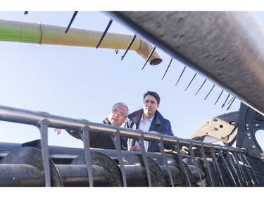 GRAY, SASK : April 27, 2017 - Rod Lewis, left, shows Prime Minister Justin Trudeau, right, around his combine at the Lewis Family Farm. MICHAEL BELL / Regina Leader-Post.