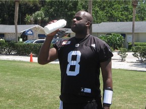 Vince Young cools off during the Riders mini-camp on Tuesday at Historic Dodgertown in Vero Beach, Fla.
