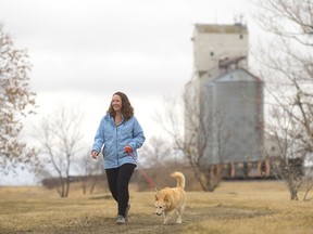 Angie Prokopetz walks her dog Chet in Pense. Prokopetz, a massage therapist, started a facebook group called the Canada 150 km Challenge to get people walking and to celebrate Canada's 150th birthday.