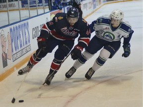 Regina Pats defenceman Connor Hobbs, left, turns the corner against the Swift Current Broncos'  Max Lajoie during Monday's first period.