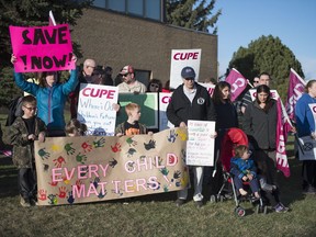 More than 60 people attended a rally outside the Regina Public School Board Office in Regina on Tuesday.