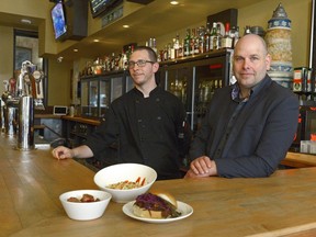 Beer Bros. co-owner Darren Carter (right) and chef Fabian Boersch are ready to serve game-day customers at their new Mosaic Stadium location.