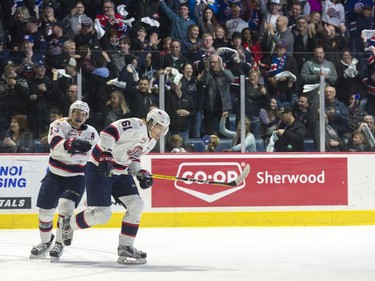 Regina Pats forward Filip Ahl #61 skates right past teammate Sam Steel #23 after scoring a breakaway goal during the seventh game of the series at the Brandt Centre.