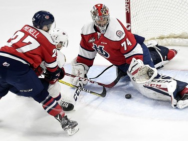 Lethbridge Hurricanes defenceman Brennan Menell and goalie Stuart Skinner combine to thwart Nick Henry of the Regina Pats in Game 2 of their WHL playoff series on Saturday night at the Brandt Centre.