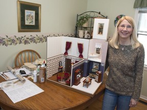Debbie Walker, a dollhouse miniaturist, stands by a work in progress in Regina.