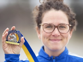 Regina resident Elizabeth Tomczak, who recently ran the Boston Marathon while pregnant, displays her medal.