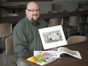 Regina comic book creator Jason Sylvestre displays his new book, Colour Saskatchewan, an adult colouring book in Regina.