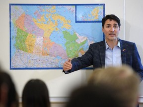 Prime Minister Justin Trudeau speaks with students of Dave Hambleton's grade 12 social studies class at Miller Catholic High School.