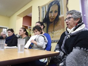 Delores Stevenson, far left in green, aunt of the late Nadine Machiskinic, speaks at the Heritage Community Association in Regina. She was one of several people gathered to talk about next steps as they "seek justice" in the death of the 29-year-old Regina woman.