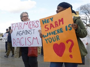 REGINA, SASK : April 3, 2017 - Protestors hold signs at a SARM Let's Get Real rally at the corner of Albert St. and Saskatchewan Drive. The group is opposed to the SARM resolution that asks for more freedom for landowners to stand their ground on their properties.