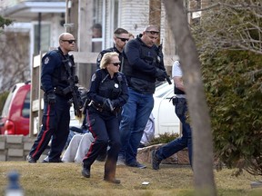 REGINA, SASK : April 4, 2017 - Regina Police Service approach a house on Mullin Ave.