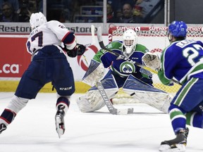 Regina Pats forward Austin Wagner fires a shot past Swift Current Broncos  goalie Jordan Papirny during Friday's WHL playoff action at the Brandt Centre.