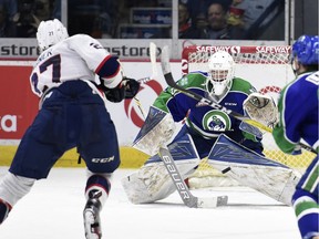 The Regina Pats' Austin Wagner, shown scoring on Jordan Papirny on Friday, got the better of the Swift Current Broncos' goalie in Game 2 of a WHL playoff series. Overall, though, Papirny has stolen the show.