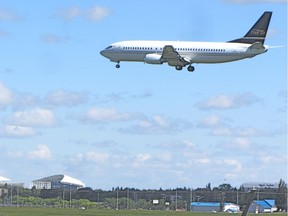 A plane lands at the Regina International Airport.