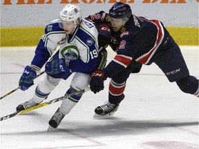 Sergey Zborovskiy of the Regina Pats defends against Lane Pederson of the Swift Current Broncos in WHL action at the Brandt Centre on Dec. 9.